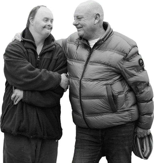 staff support worker supporting an individual b&W